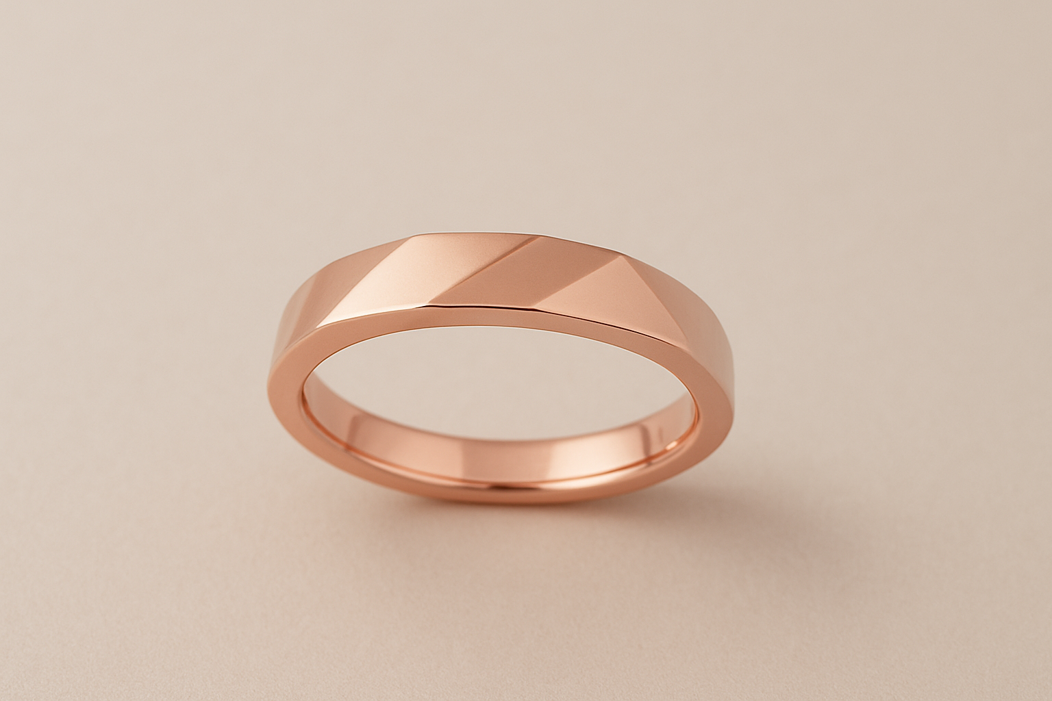 Rose gold ring photographed from the side showing band thickness and dimensional cuts