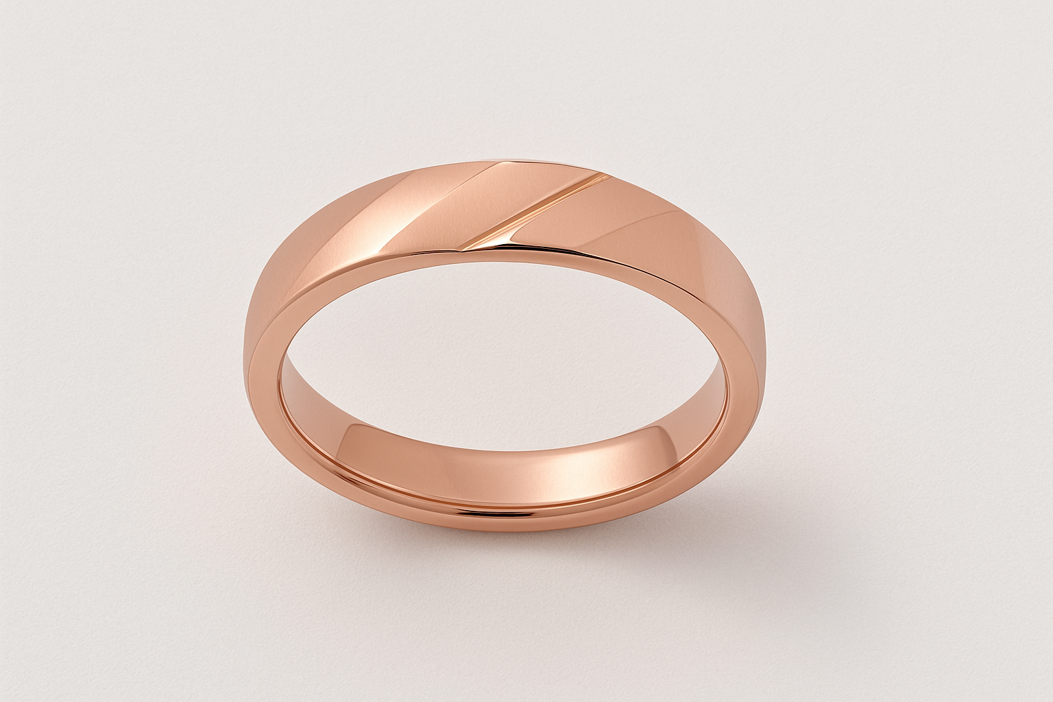 Rose gold ring shown from above displaying the geometric faceted pattern