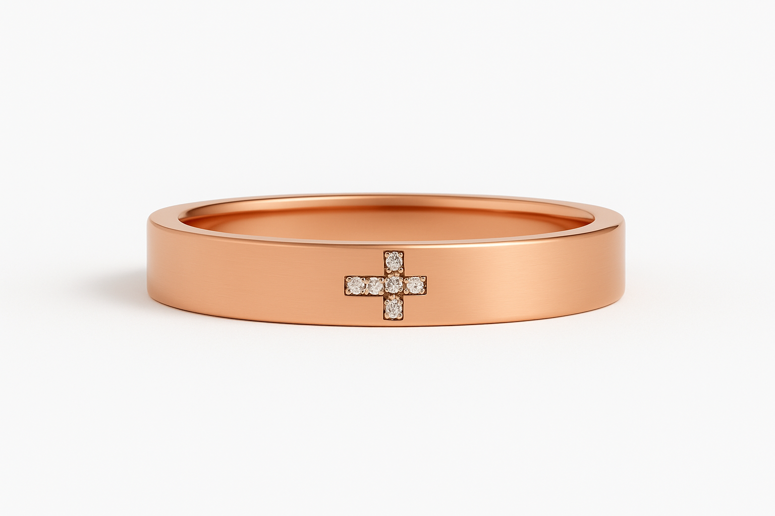 Rose gold ring with diamond cross laying flat